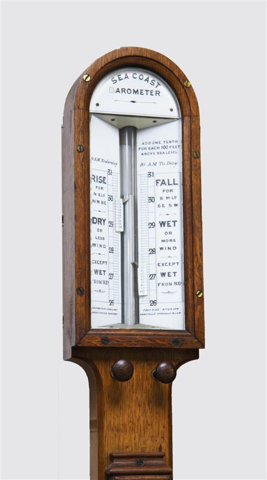 A late Victorian golden oak Sea Coast barometer, 42in.